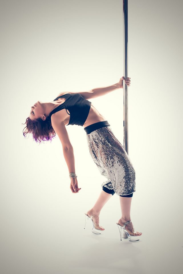 Pole Fitness standing pose in silver hareem pants